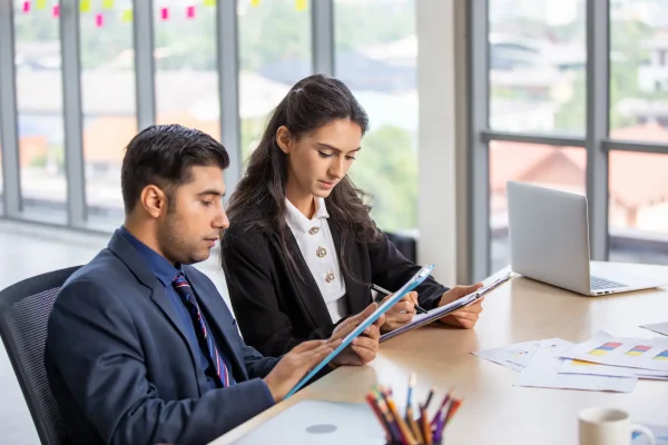 two-colleagues-working-business-center-having-business-meeting